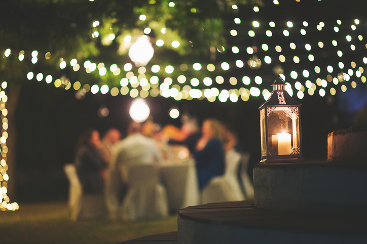 Candle and string lights outdoor dinner